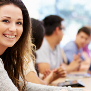 Smiling student with other students in the background